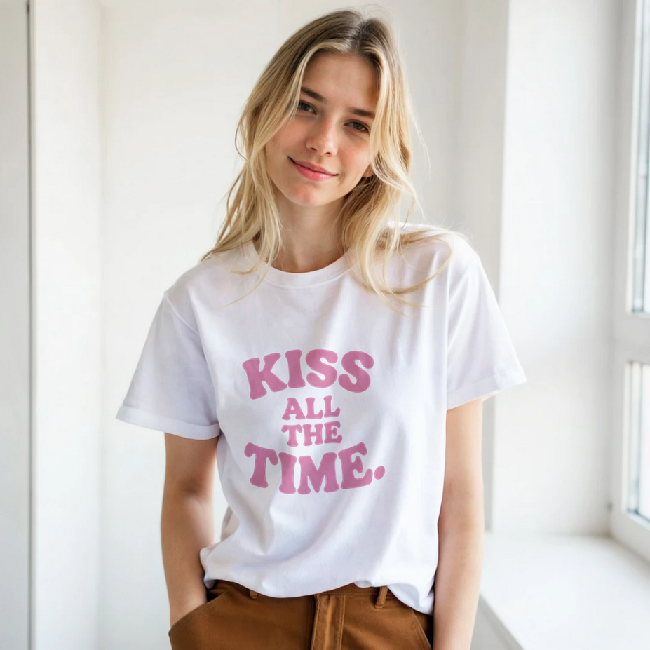 Woman wearing a white t-shirt with pink graphic and text